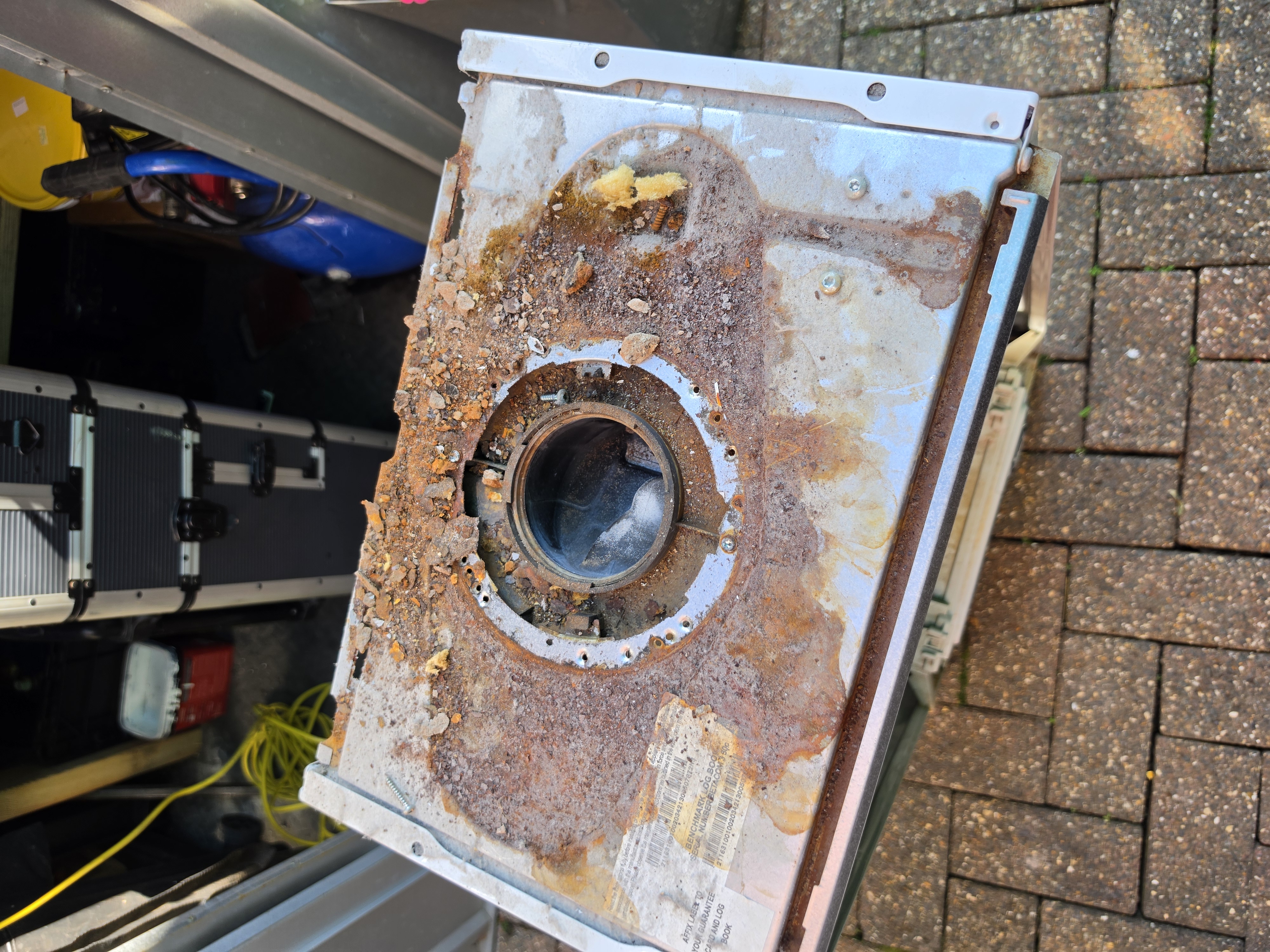 Top of boiler corroded by flue leak — real job photo from Lewis Heating & Plumbing Wigan