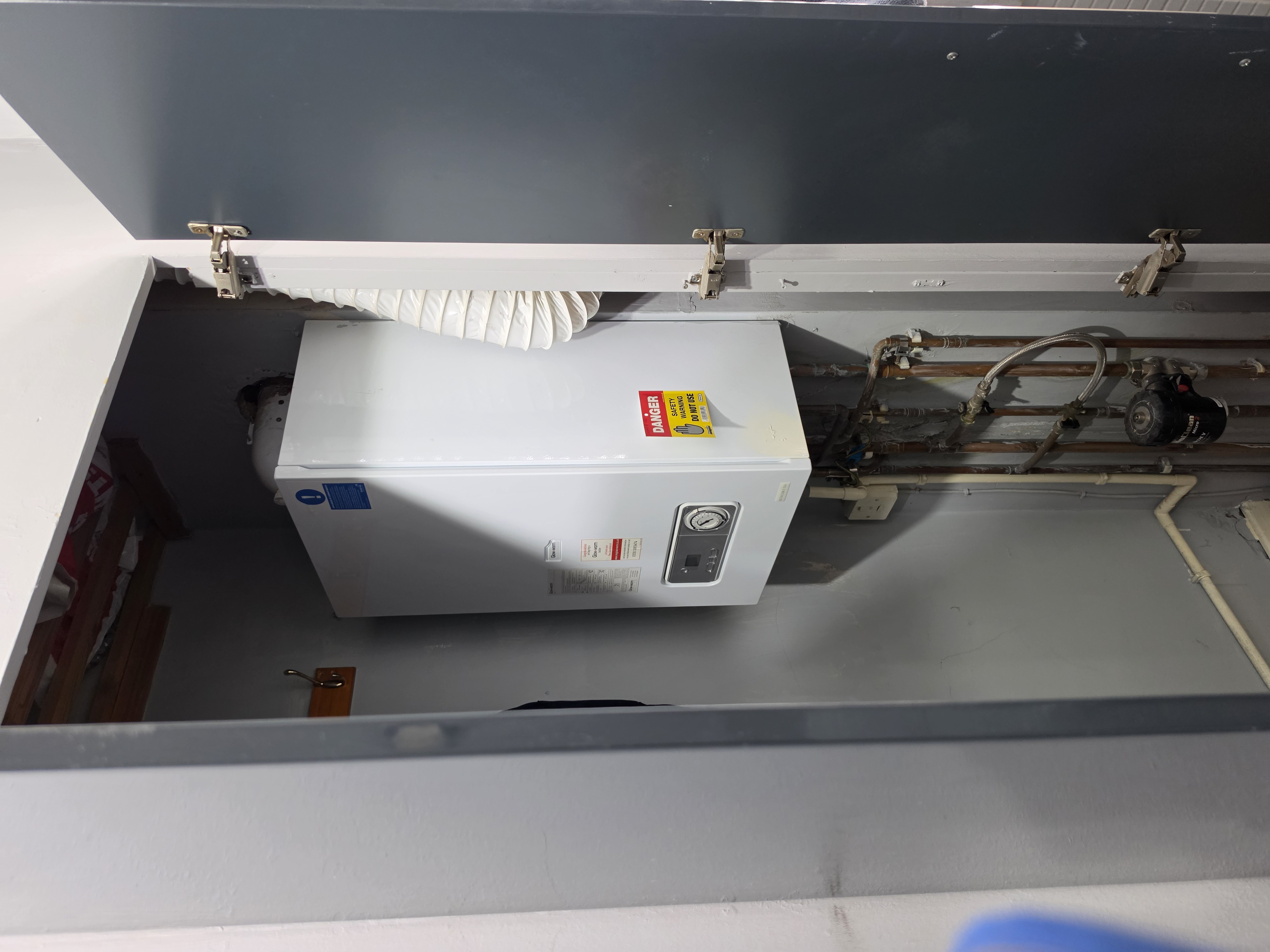 Condemned boiler with Danger Do Not Use safety warning sticker — Gas Safe engineer Lewis Heating Wigan